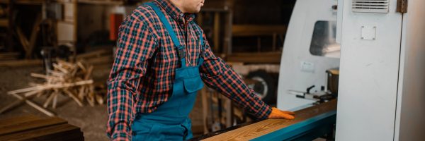 woodworker-works-on-machine-lumber-industry
